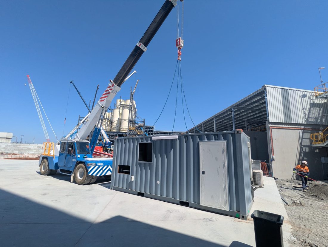 Mobile crane lifting a module