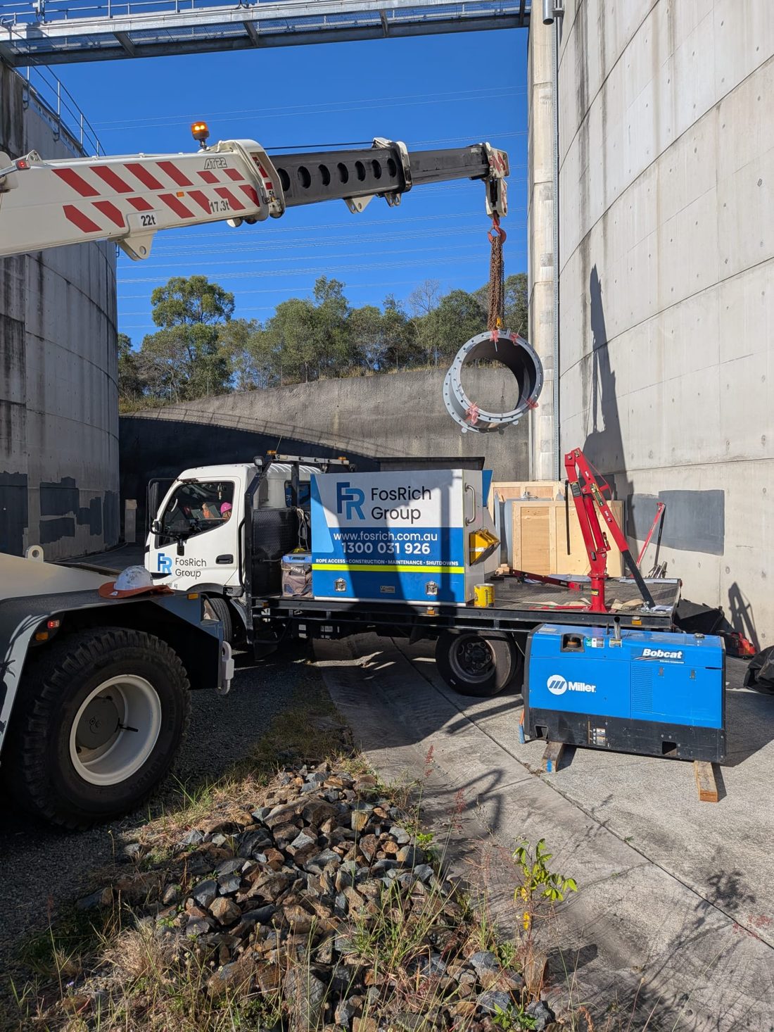 FosRich branded crane truck on a construction and maintenance site